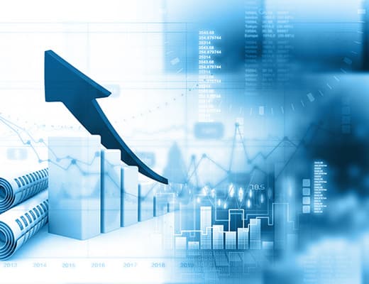 Financial analyst reviewing reports at a desk