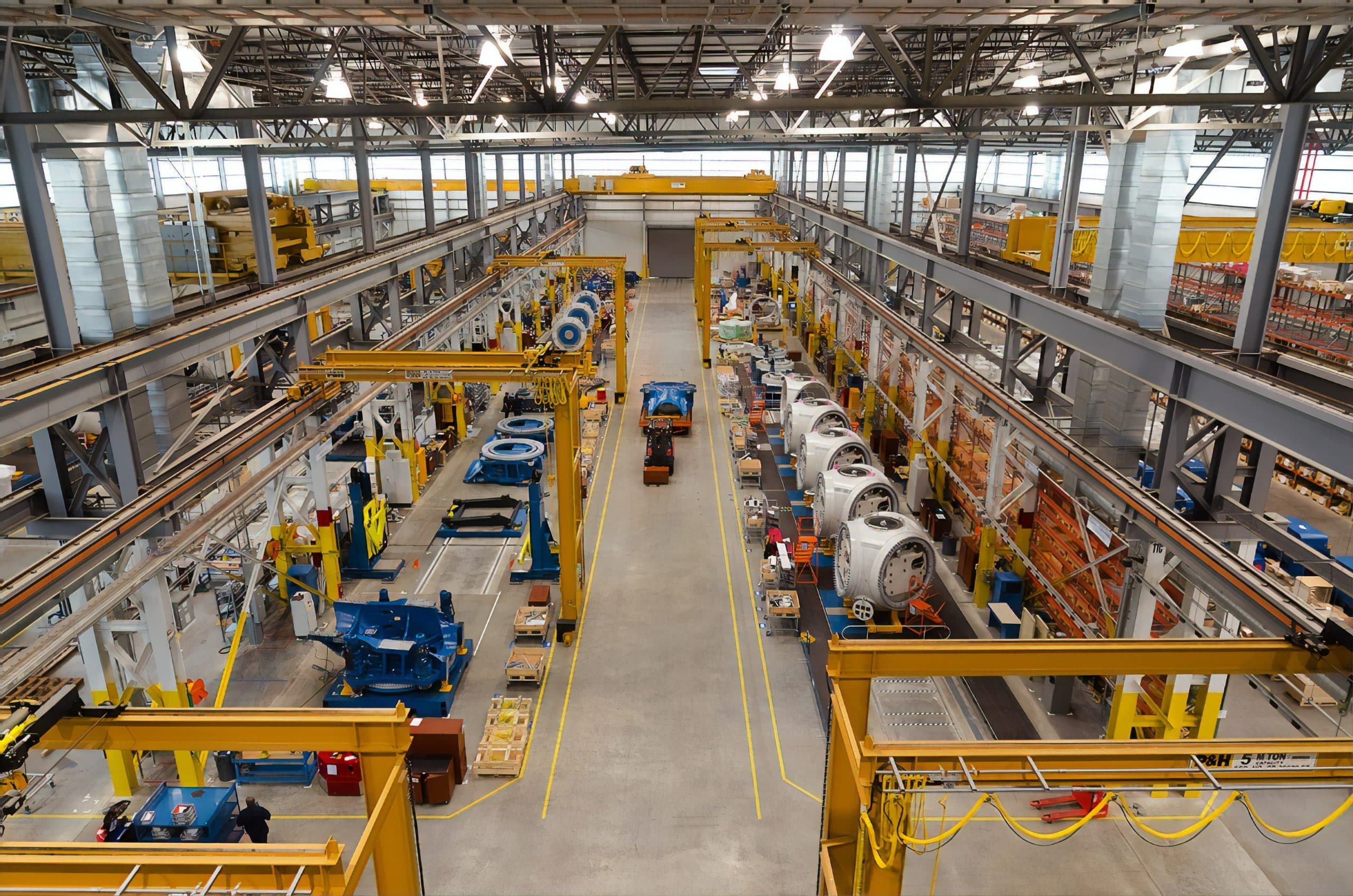 Engineer reviewing a tablet on a factory floor