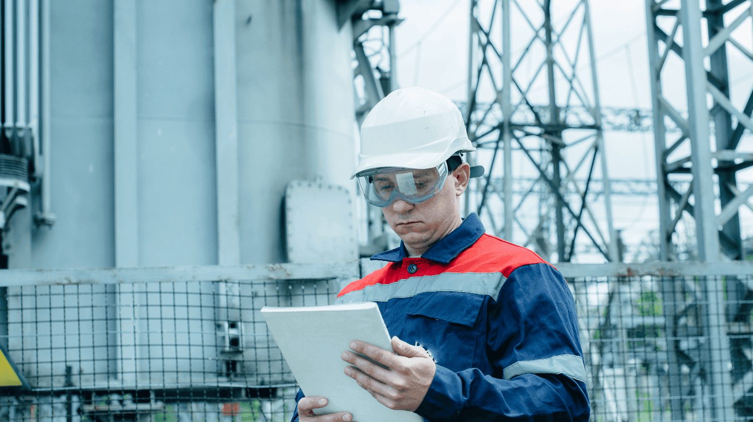 Utilities worker reviewing asset data on a tablet